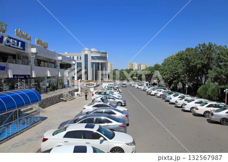 Ashgabat, Turkmenistan - May, 20, 2023: Parking near the shopping center. Ashgabat, Turkmenistan - May, 20, 2023: Parking near the shopping center. 132567987