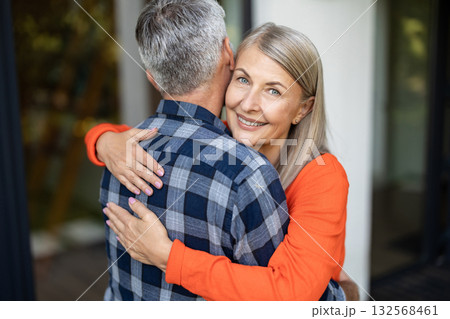 Man and woman hugging each other and looking happy and in love 132568461