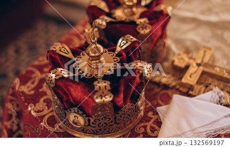 Orthodox wedding crown and cross, close-up ceremony symbols Orthodox wedding crown and cross, close-up ceremony symbols 132569197