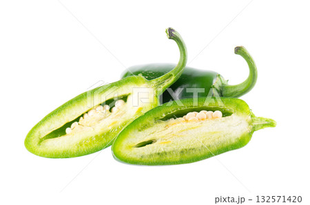 Fresh jalapeno pepper isolated on white background. Slices of green hot serrano pepper. Clipping path. Fresh jalapeno pepper isolated on white background. Slices of green hot serrano pepper. Clipping path. 132571420