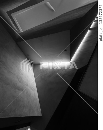 Abstract architectural space with sharp angles and glow edge light in black and white 132572372