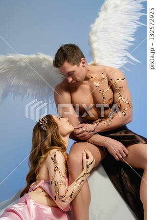 Ethereal encounter between angel and mortal in a serene setting Ethereal encounter between angel and mortal in a serene setting 132572925
