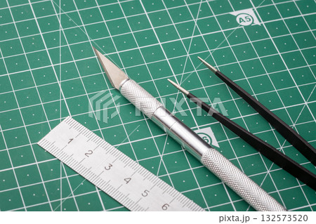 Stationery equipment on a cutting mat Stationery equipment on a cutting mat 132573520