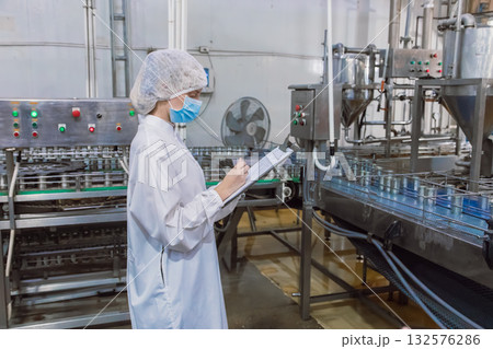 food cannery industry hygiene worker at conveyor belt, factory clean and hygiene inspector team food cannery industry hygiene worker at conveyor belt, factory clean and hygiene inspector team 132576286