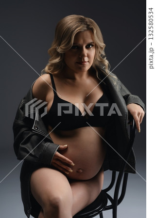 Pregnant Woman in a Leather Jacket 132580534
