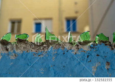 close-up fence with broken glass 132581555