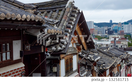 Bukchon Hanok Village rooftops contrasting Seoul cityscape Bukchon Hanok Village rooftops contrasting Seoul cityscape 132581715