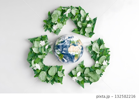 Green leaves form a recycle symbol around planet earth. Green leaves form a recycle symbol around planet earth. 132582216