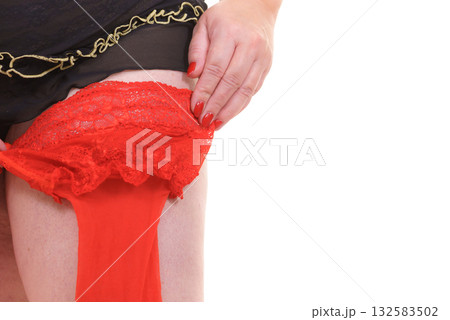 Woman plus size puts on red nylon stockings 132583502