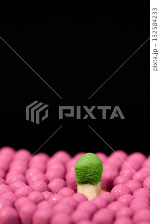 Big green matchstick above others. Concept of different, another, stand out from the others concept Big green matchstick above others. Concept of different, another, stand out from the others concept 132584233