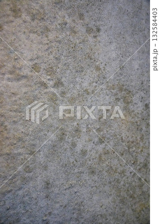 Close-up of mold and mildew spreading on a damp interior wall. Concept of moisture damage, humidity, and unhealthy living conditions. 132584403
