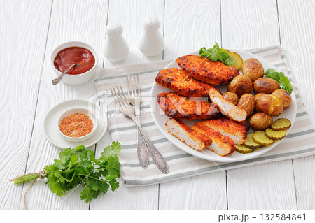 Paprika-Rubbed Pork Chops on plate with potatoes 132584841