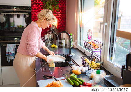 Woman preparing healthy food in modern kitchen 132585077