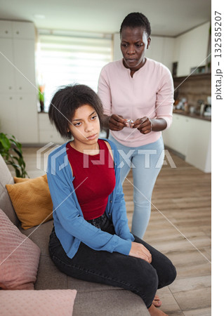 Mother scolding her teenage daughter at home 132585207