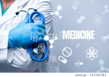 Medical professional holding a stethoscope with health symbols in the background Medical professional holding a stethoscope with health symbols in the background 132585361