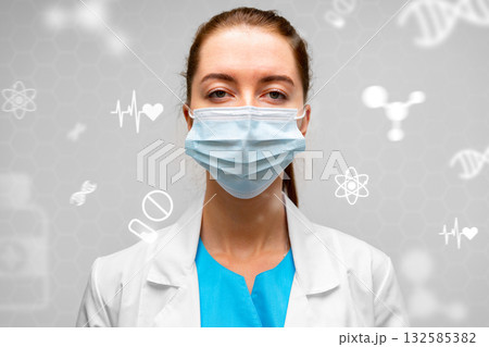 Medical professional wearing mask with health symbols in the background Medical professional wearing mask with health symbols in the background 132585382