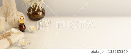 Wellbeing, cosmetology banner with spa accessories, serum, candles and towel on a white table. Wellness and skin care treatment. Concept of me time and self-care. Spa relax, massage procedure 132585549