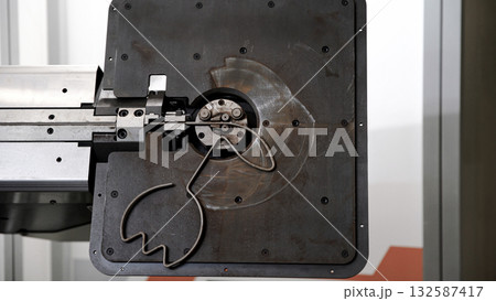 Wire bending machine. CNC metal processing. Automated metalworking machine. Wire bending machine. CNC metal processing. Automated metalworking machine. 132587417