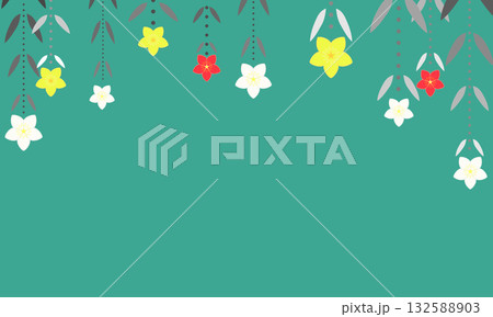 上から垂れ下がった黄色と白と赤のクリスマスローズが飾られた緑色の背景 132588903