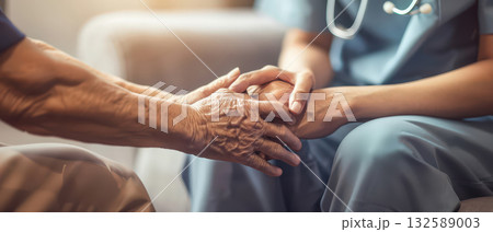 Nurse holding elderly hands showing empathy and support Nurse holding elderly hands showing empathy and support 132589003