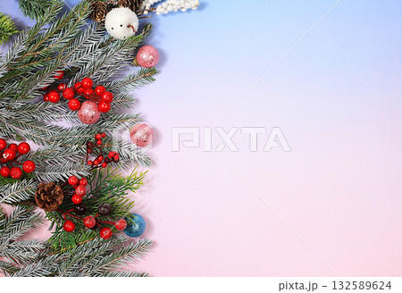 Beautiful Christmas and New Year background with lights, decorations, toys with fir branches with place for text. Holiday card, banner on screen, product setup for holiday advertising, 132589624