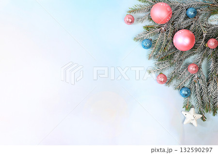 Beautiful Christmas and New Year background with lights, decorations, toys with fir branches with place for text. Holiday card, banner on screen, product setup for holiday advertising, 132590297