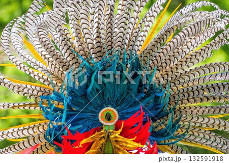 Vibrant feather headdress with intricate designs 132591918