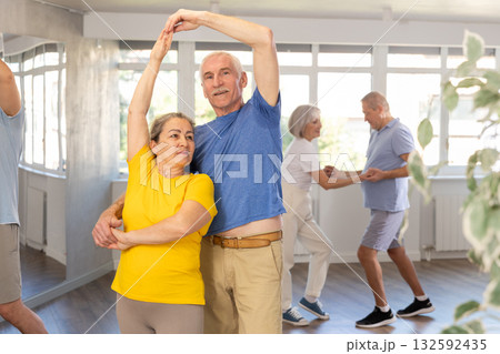 Couple of elderly man and woman dancing waltz 132592435