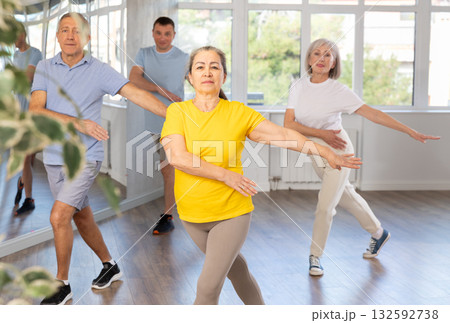Elderly woman dances modern dances in group 132592738