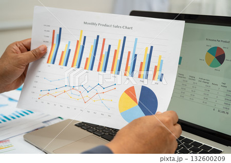 Asian business woman working with financial graph. Asian business woman working with financial graph. 132600209