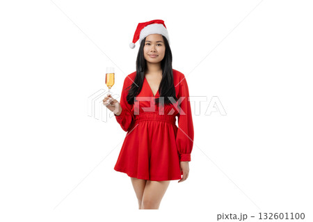 Woman in red dress and Santa hat holds champagne glass, isolated, PNG 132601100