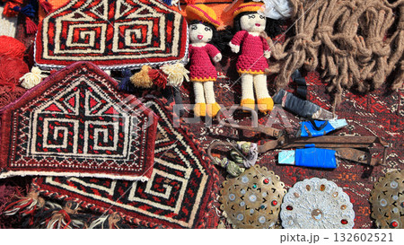 National amulets, old carpet-making tools and vintage silver jewelry.   Turkmenistan. Ashkhabad market. 132602521