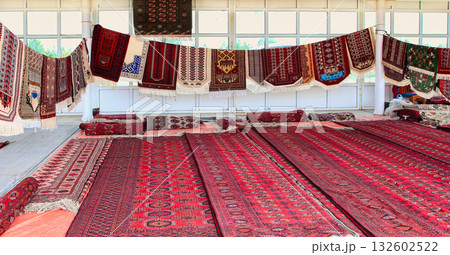 Pavilion selling Turkmen handmade carpets. Handmade carpets with traditional ornament. Turkmenistan. Ashkhabad market. Pavilion selling Turkmen handmade carpets. Handmade carpets with traditional ornament. Turkmenistan. Ashkhabad market. 132602522