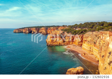 Rocky seascape. View of Praia da Marinha beach in the Algarve region in the Atlantic ocean, Portugal, Europe Rocky seascape. View of Praia da Marinha beach in the Algarve region in the Atlantic ocean, Portugal, Europe 132602916
