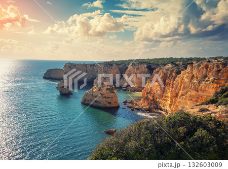 Coastal rocky seascape. View of Praia da Marinha beach in the Algarve region. Atlantic ocean. Portugal, Europe 132603009
