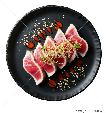 Delicious bigeye tuna sashimi, fresh Japanese food with daikon sprout and sesame, served on dark plate 132603756