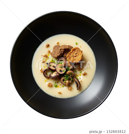 Gourmet mushroom soup, creamy veloute with truffle and chive in dark bowl for comforting and elegant meal 132603812