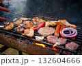 Assorted delicious grilled meat with vegetables over the coals on a barbecue 132604666