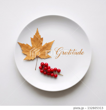 maple leaf and berries on a plate with the word gratitude maple leaf and berries on a plate with the word gratitude 132605313