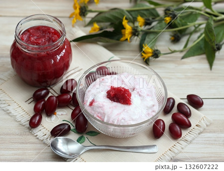 Dessert from cottage cheese and homemade preserved jam from Cornelian cherry dogwood, lat. Cornus mas macrocarpa. Dessert from cottage cheese and homemade preserved jam from Cornelian cherry dogwood, lat. Cornus mas macrocarpa. 132607222