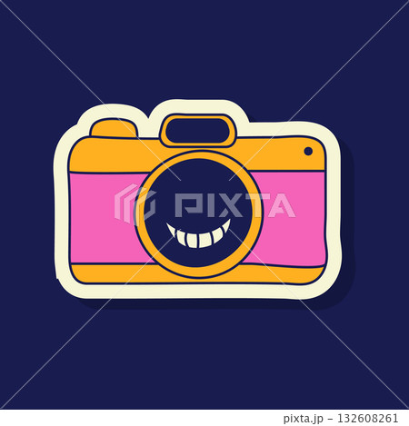 A vector illustration showcases a charming Y2K-style camera sticker. It is designed with a smiley face in the lens, and outlined in cheerful yellow and pink colors. 132608261