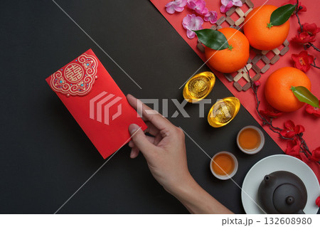 Chinese New Year red envelope with tea and oranges 132608980