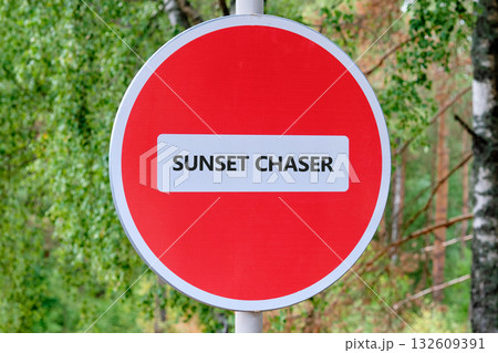 A red circle sign with a white stripe in the middle tells us that it is for Sunset Chasers. Trees and sky in the background. It looks like a secret sign for a club 132609391