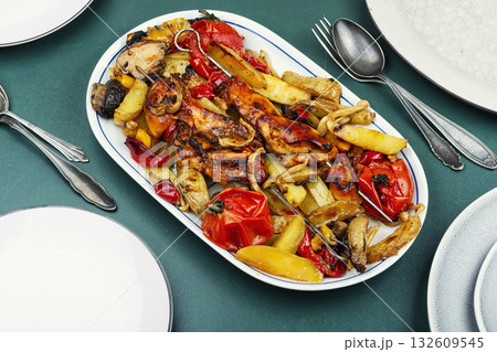 Chicken breast baked in vegetables. 132609545