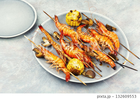 Grilled langoustines on skewers. 132609553