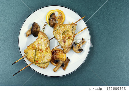 A piece of tuna cooked on a grill. 132609568