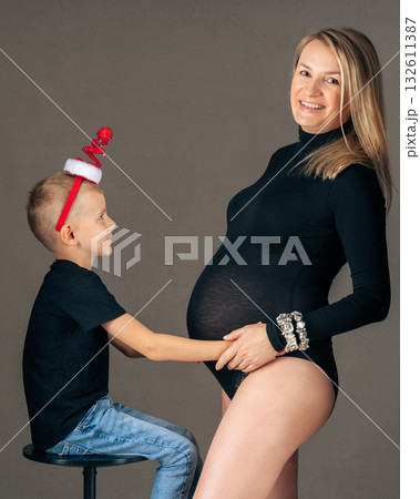 Maternity photo of mother and son, cheerful connection and family love. 28 week Maternity photo of mother and son, cheerful connection and family love. 28 week 132611387