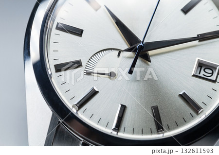 Shiny metallic clock face with the power reserve indicator and date window Shiny metallic clock face with the power reserve indicator and date window 132611593