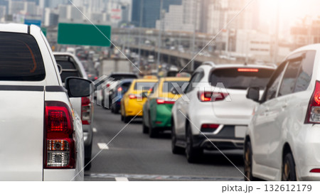 Rear side of pickup car white color traffic jam on the asphalt road. Many cars are parked in a row on the road due to heavy traffic. Blurry of many cars on the expressway at Bangkok Thailand. 132612179