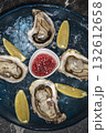 fresh galician raw oysters on ice in gourmet vigo restaurant table in spain 132612658